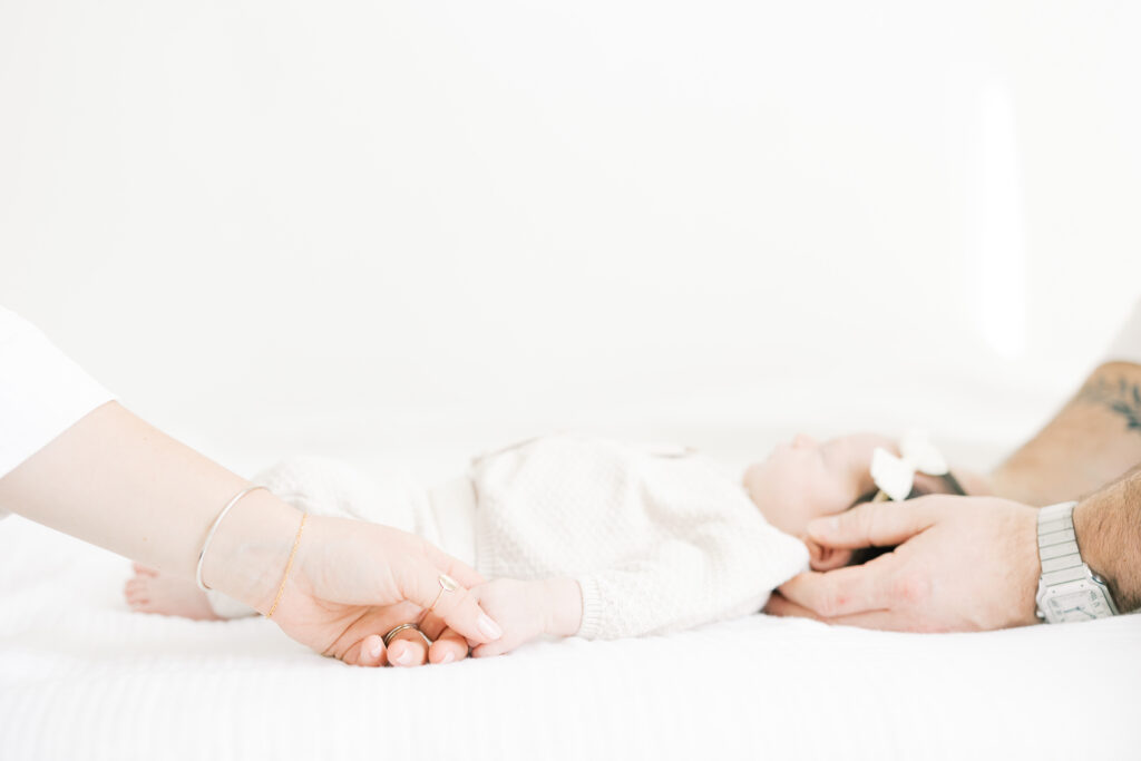 ampa newborn photographer sharing the honest differences between studio and in-home sessions and why studio photography creates timeless, stress-free results.